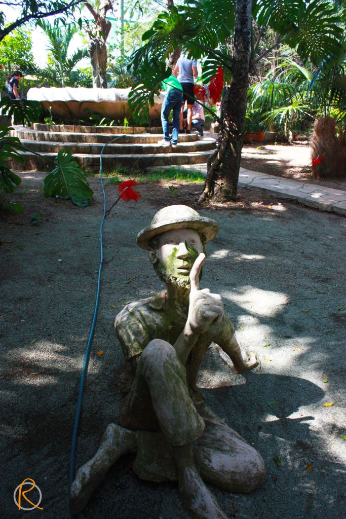 Little stone man asking for your silence